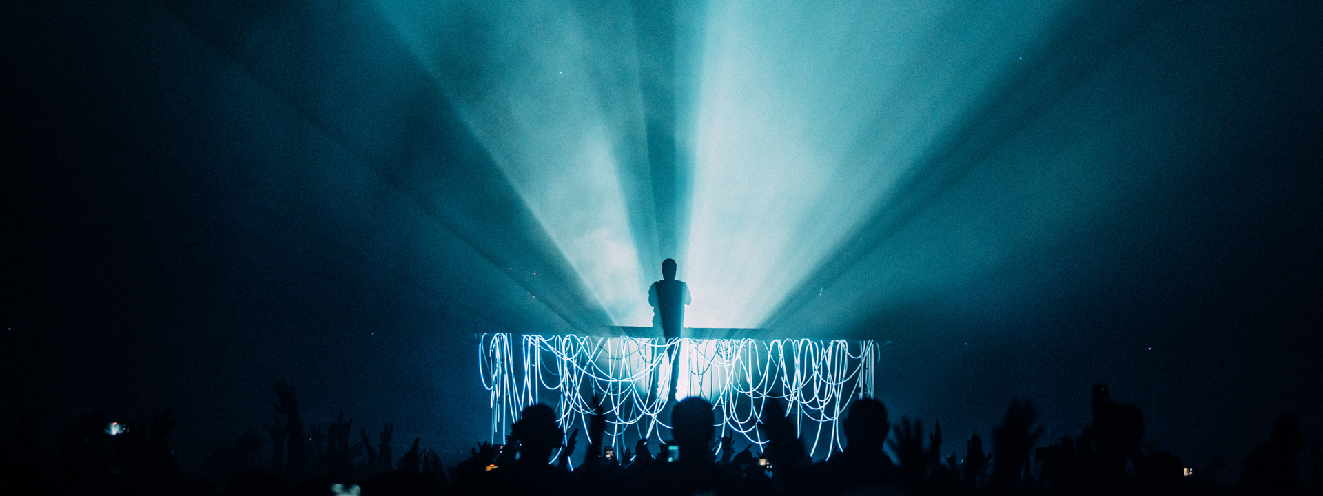 Silhouette of duke dumont standing on stage
